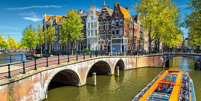 A glass topped tourist boat on the canals of Amsterdam